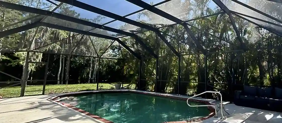 Rescreened pool enclosure by Curly Tail Screen & Window in Jupiter, Florida